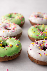 White and green Sprinkled delicious doughnuts.
