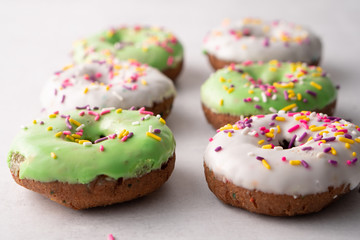 White and green Sprinkled delicious doughnuts.