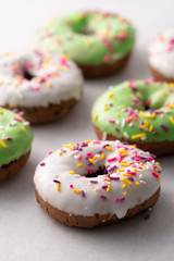 White and green Sprinkled delicious doughnuts.