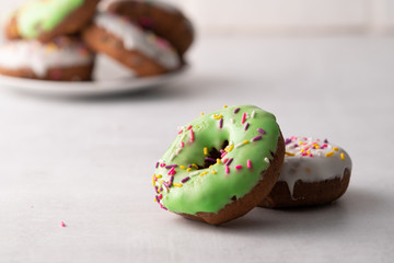 White and green Sprinkled delicious doughnuts.