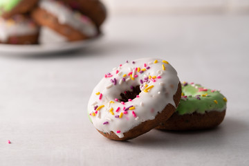 White and green Sprinkled delicious doughnuts.