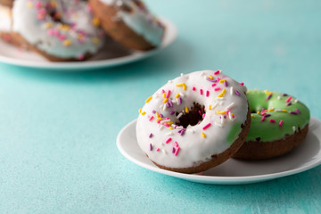 White and green Sprinkled delicious doughnuts.