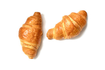 Two plain fresh croissants isolated on white