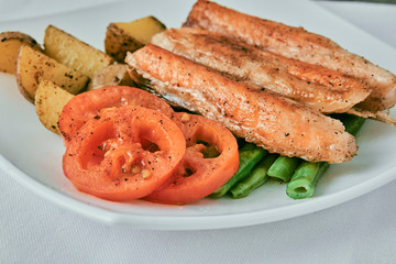 salmon with tomatoes green peas and potatoes