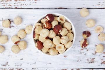 A bowl with shelled hazel nuts	