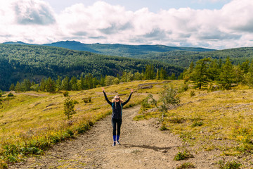 young female tourist in the mountains