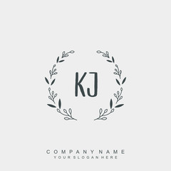 letter KJ surrounded by beautiful and elegant flowers and leaves. Wedding monogram logo template.