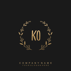 letter KO surrounded by beautiful and elegant flowers and leaves. Wedding monogram logo template.