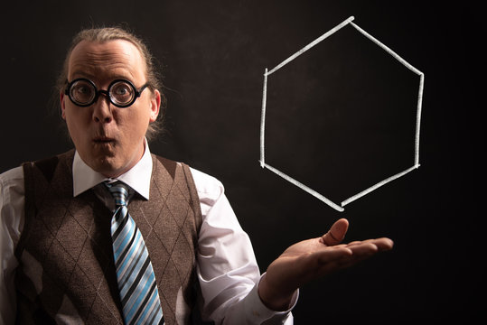 Professor presenting handdrawn chemical formula of cyclohexane