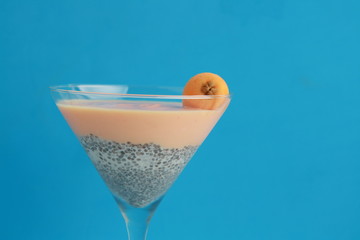 glass with chia and medlars pudding