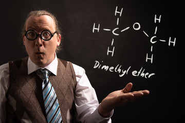 Professor presenting handdrawn chemical formula of Dimethyl ether methoxymethane DME