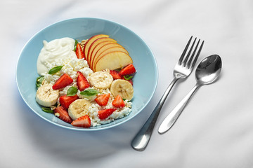 Breakfast in the form of fruits with a delicate cream, strawberries and dairy products.