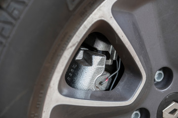 The image of a car brake caliper