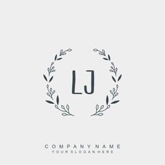 letter LJ surrounded by beautiful and elegant flowers and leaves. Wedding monogram logo template.