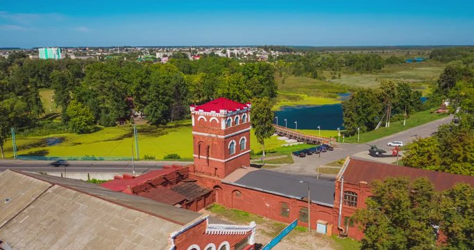Tower red workshop of the old Paper mill in Belarus. Historical object. Drone flying around the tower
