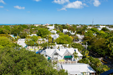 Fototapeta premium he historic and popular center and Duval Street in downtown Key West. Beautiful small town in Florida, United States of America. With colorful houses.