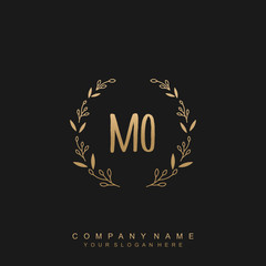 letter MO surrounded by beautiful and elegant flowers and leaves. Wedding monogram logo template.