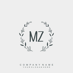 letter MZ surrounded by beautiful and elegant flowers and leaves. Wedding monogram logo template.