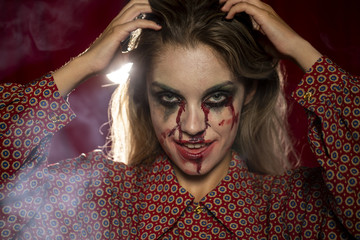 Halloween female model fixing her hair
