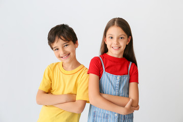 Portrait of cute children on light background © Pixel-Shot