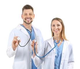 Fototapeta premium Male and female doctors with stethoscopes on white background