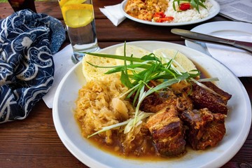 Roasted pork meat,cabbage and dumpling on tabel.