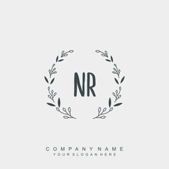 letter NR surrounded by beautiful and elegant flowers and leaves. Wedding monogram logo template.