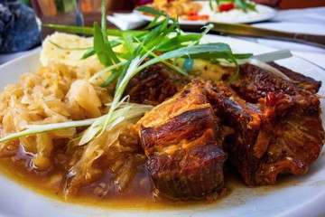 Roasted pork meat, cabbage, dumpling.