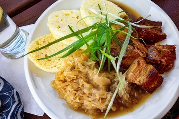 Roasted pork meat, cabbage and dumpling.