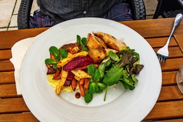 Chicken meat, vegetable french fries, leaf, mashed potato.