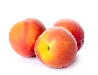 Fototapeta na wymiar Ripe peaches on white background