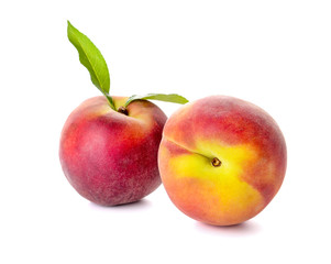 Ripe peaches on white background