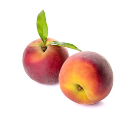 Ripe peaches on white background