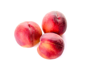 Ripe peaches on white background