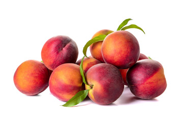 Ripe peaches on white background