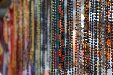 Indian beads and jewelry on the counter in store.