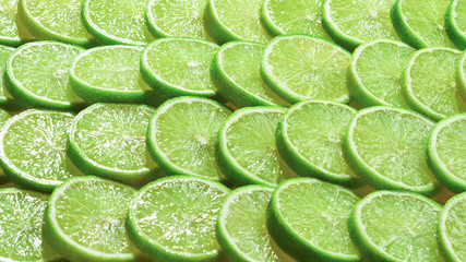 Fresh lime slices as a background.