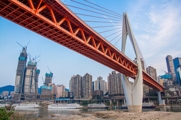Chongqing, China. Chinese city of Chongqing, Jialing riverbank. Yuzhong District. Qianshimen bridge and Raffles City Chongqing T4N view.