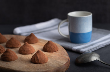 Fototapeta na wymiar chocolate truffles on a wooden plate