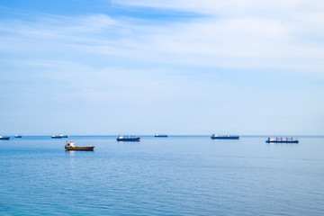 Cargo ships and barges at sea, squadron of cargo ships.