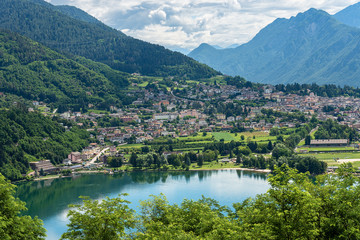 Fototapeta na wymiar Aerial view of the small town of Levico Terme with the lake (Lago di Levico) and the mountains, Alps. Trentino Alto Adige, Italy, Europe