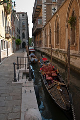 Venice, Italy: Canal with two gondolas in Venice, Architecture and landmarks of Venice
