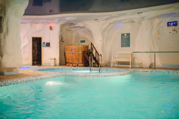 the interior of the aquazone in a spa salon: swimming pool and a janapese tube
