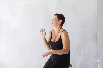 Mature with short hair laughing