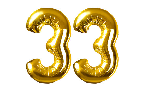 Happy 33 years old party with golden shiny inflatable balloons isolated on white