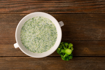 creamy broccoli soup with cheese top view