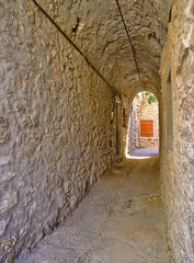Narrow alley at the medieval castle village of Mesta in Chios island , Greece.