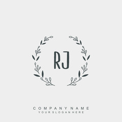 letter RJ surrounded by beautiful and elegant flowers and leaves. Wedding monogram logo template.