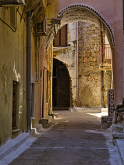 Narrow alley with decorated tunnel, in Pyrgi  medieval village, Chios island, Greece.