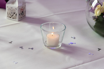candle with decoration on  wedding table